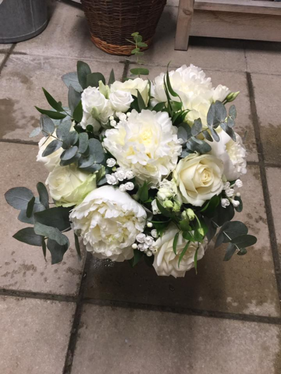 Beauty in Creams - Cream roses and other stunning cream flowers in a gorgeous hand tied bouquet sure to put asmile on anyones face